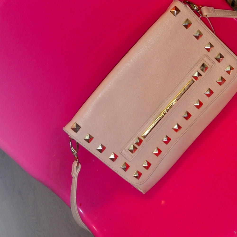 A pink purse Steve Madden a little damaged